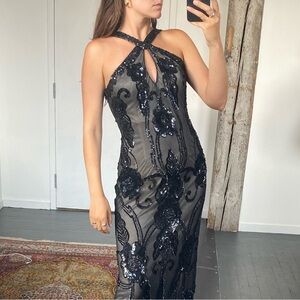 Full length beaded black tie gown with intricate neckline